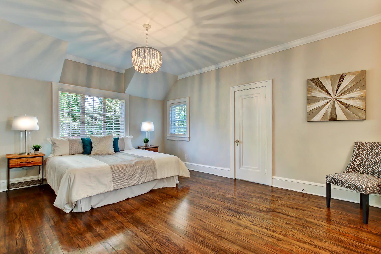 Master bedroom in Avondale home with original hardwood floors